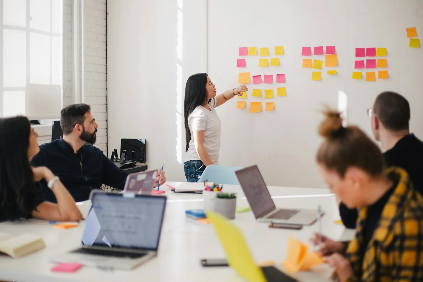 Colleagues considering ideas in a working discussion; illustrative photography